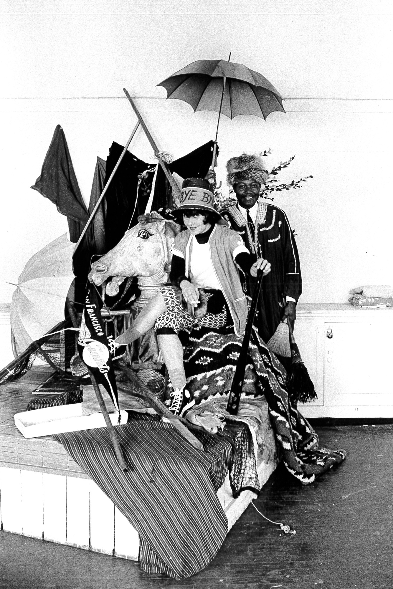 Unknown photographer, Jay DeFeo and Hayward King posing with props at SFAI in what appears to be Studio 13, 1962